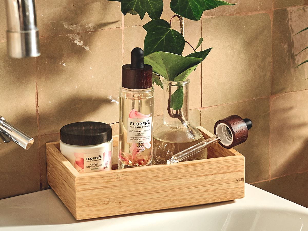 florena facial oil and cream in a basket on the sink