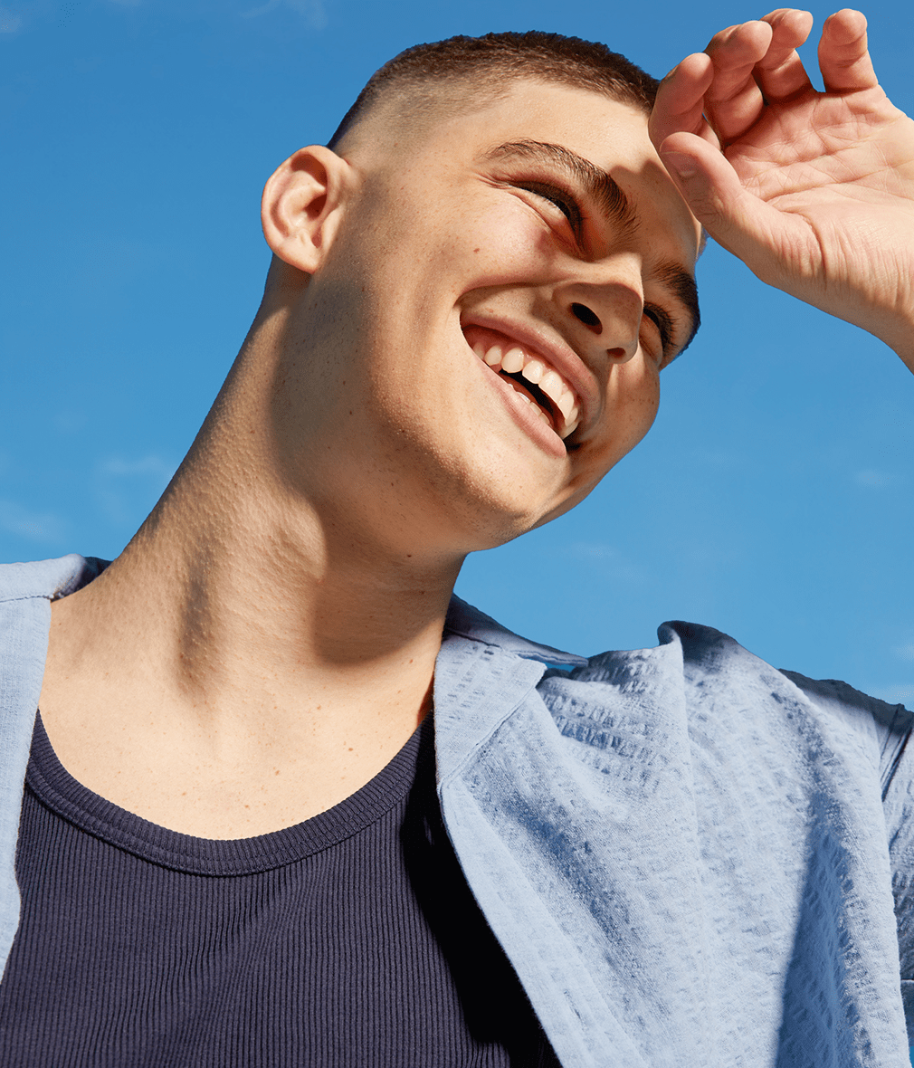 man holding a Nivea Sensitive Calming Pro face cream