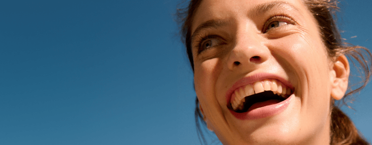 woman with beautiful clear skin laughing