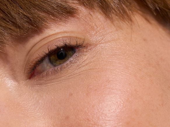 woman applying eye cream