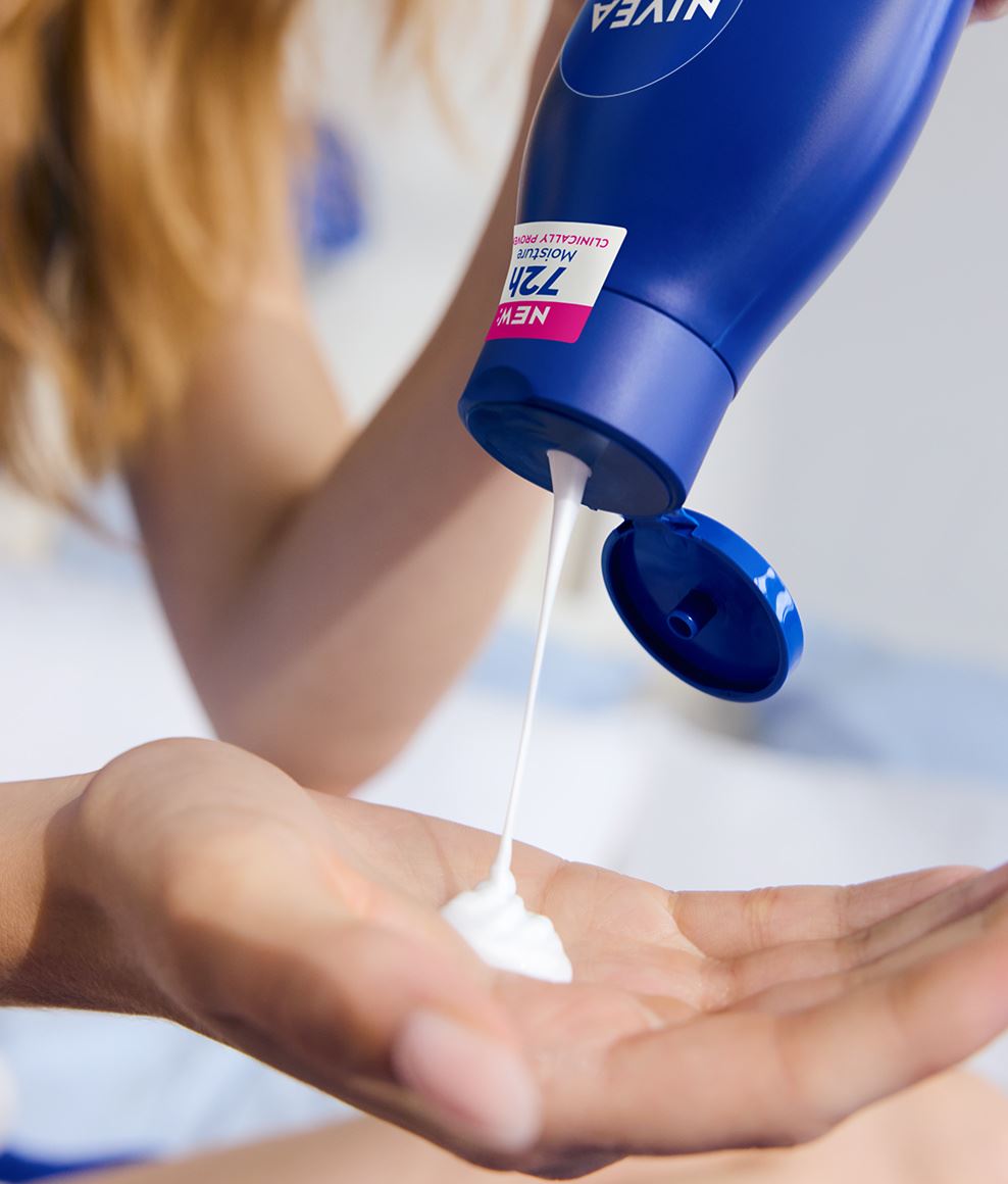 NIVEA rich nourishing body milk lotion poured in the palm