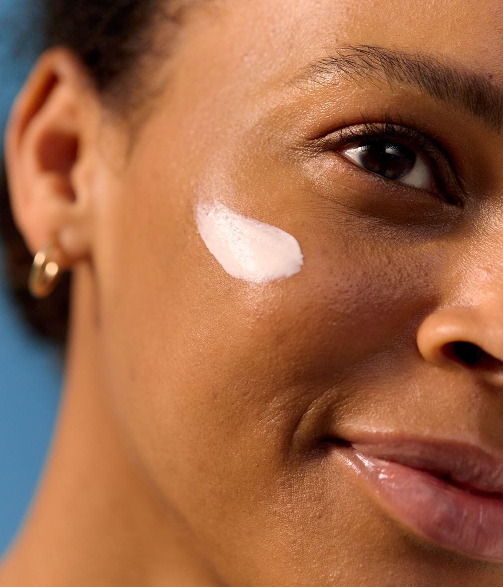 woman using Nivea face cream