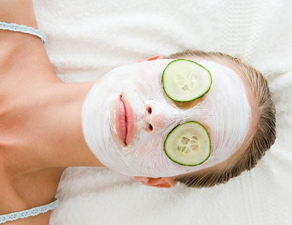 lady lying down with a face mask applied