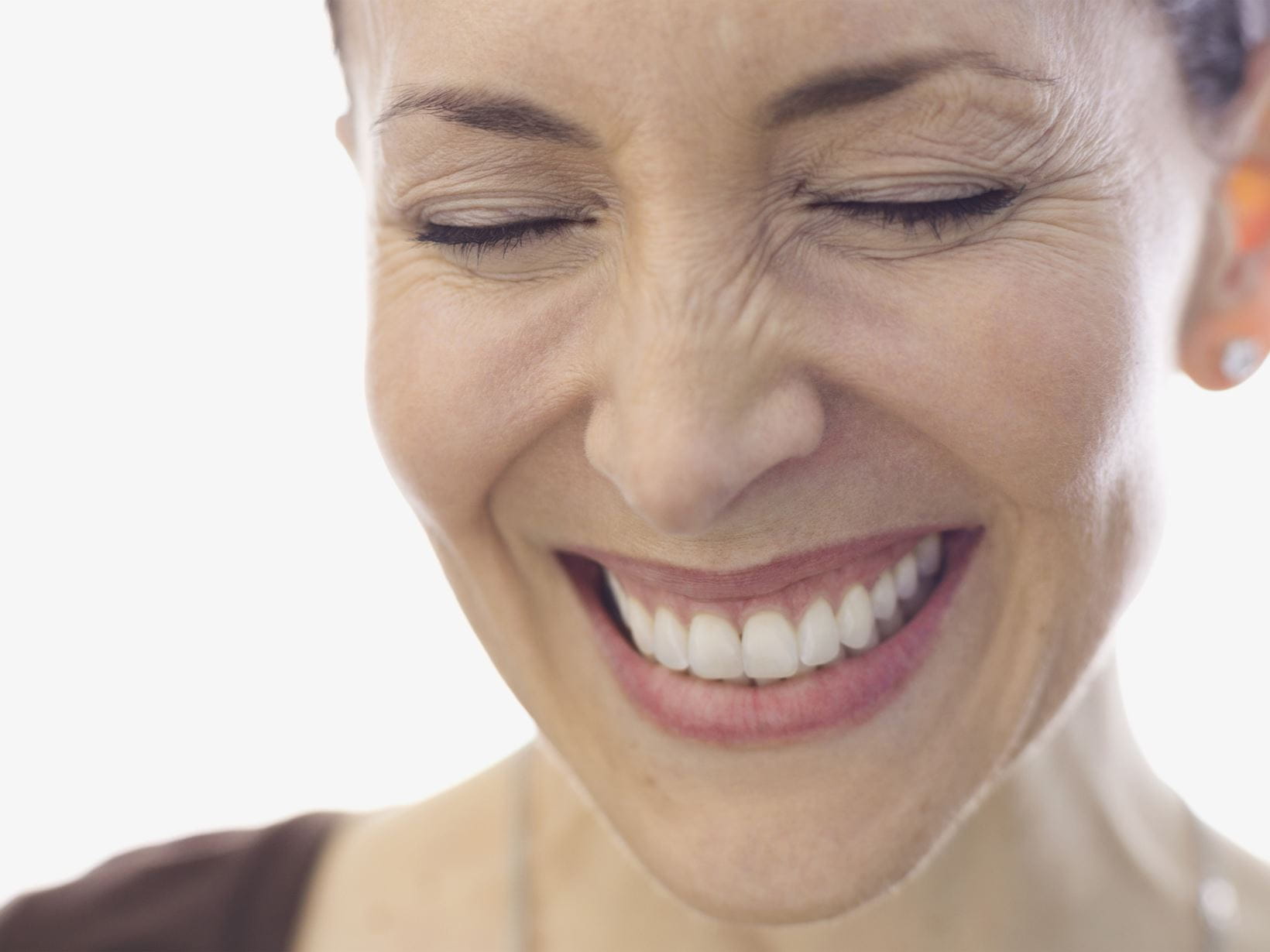 woman with eye wrinkles smiling