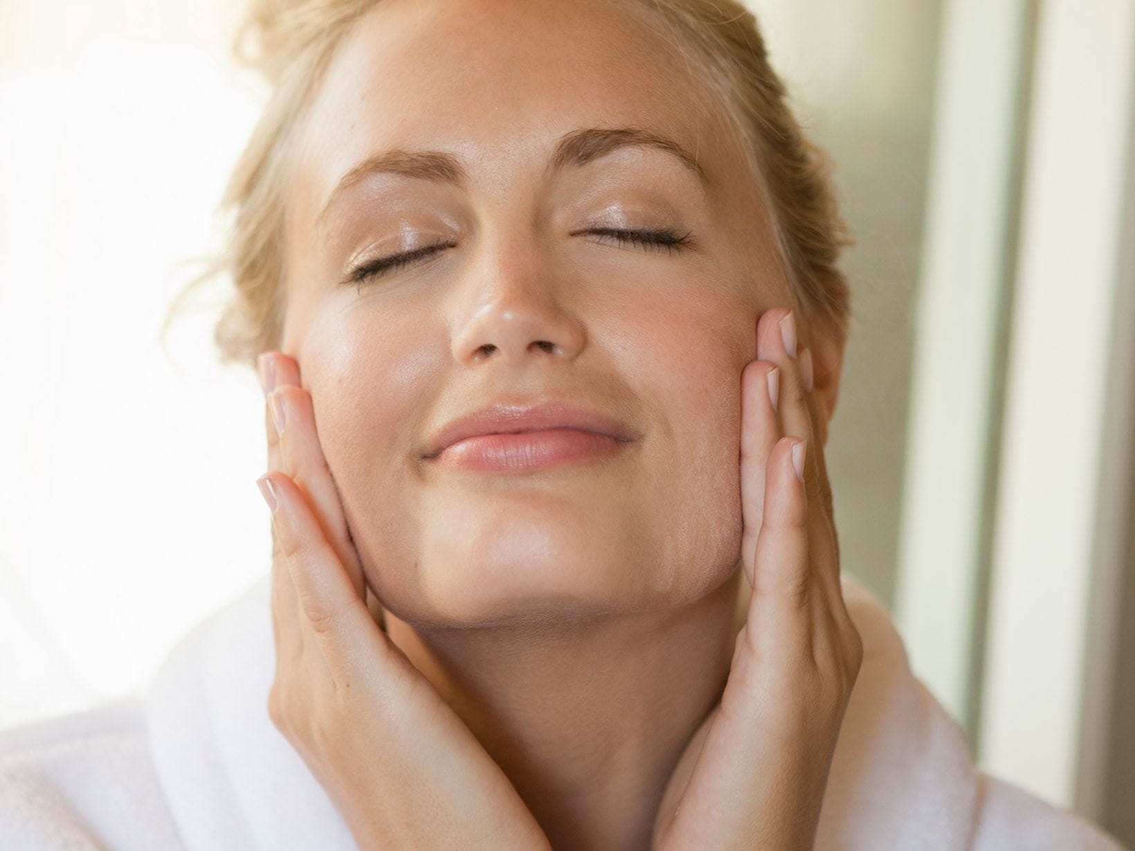 woman massaging face