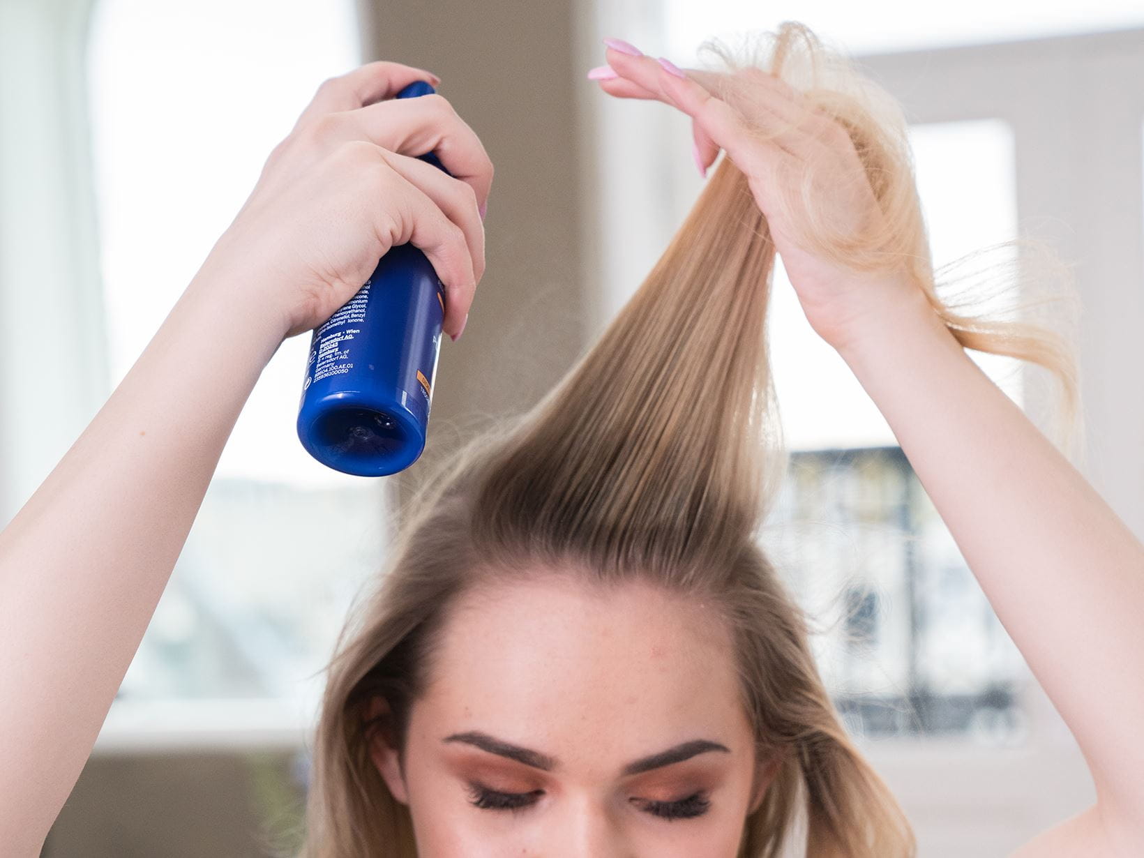 High top ponytail step 2: hairspray