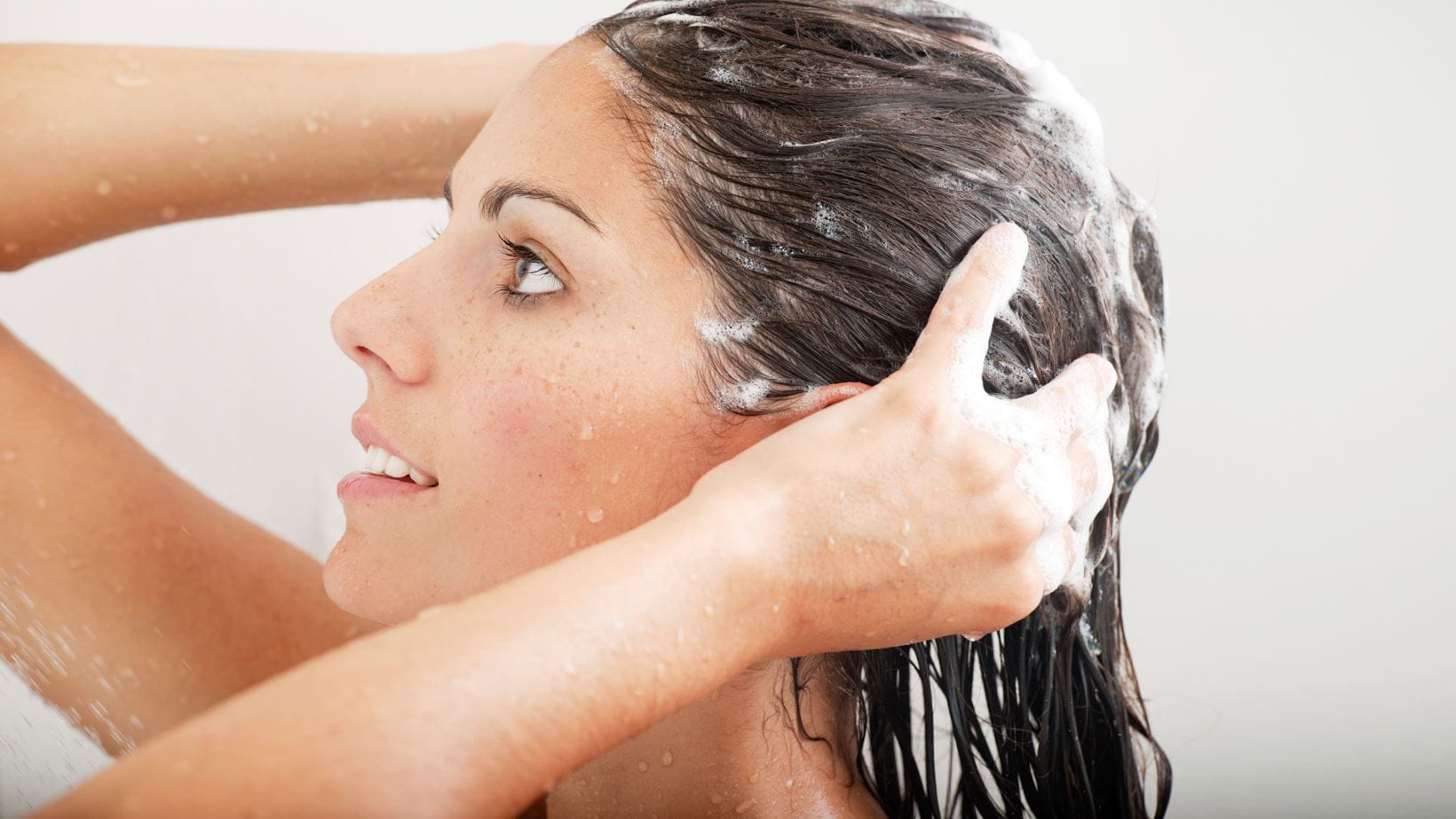 Woman shampooing her hair