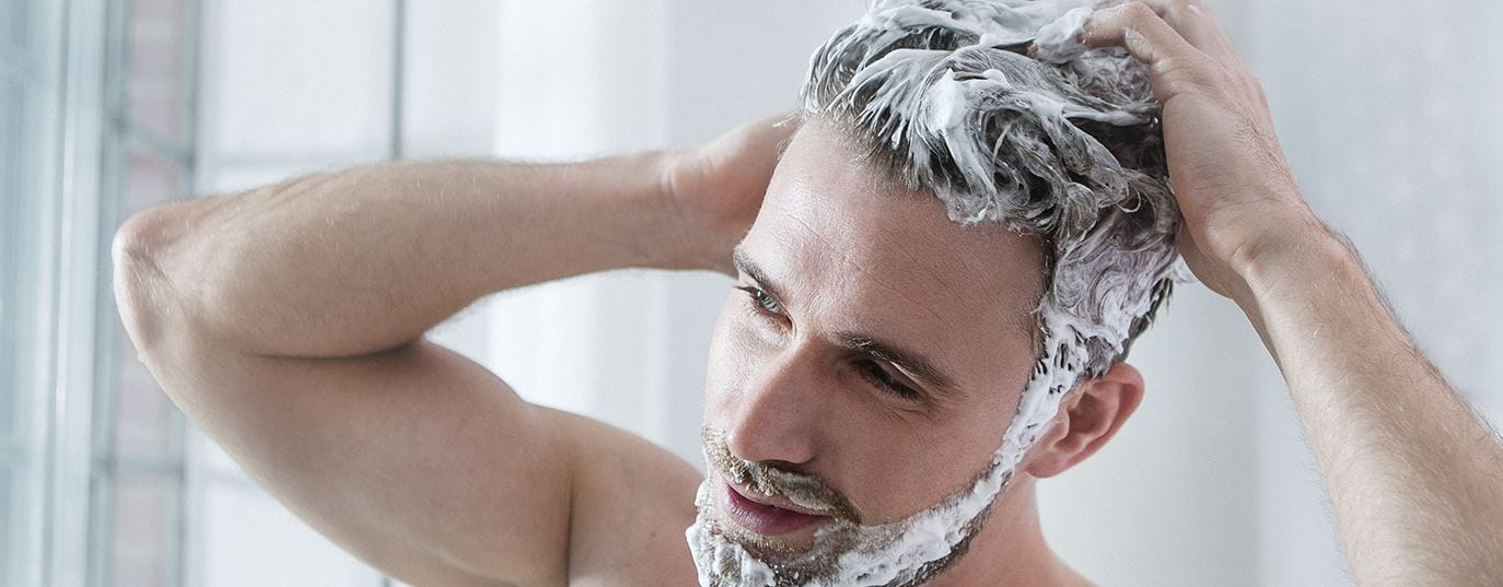 man shaving before the shower
