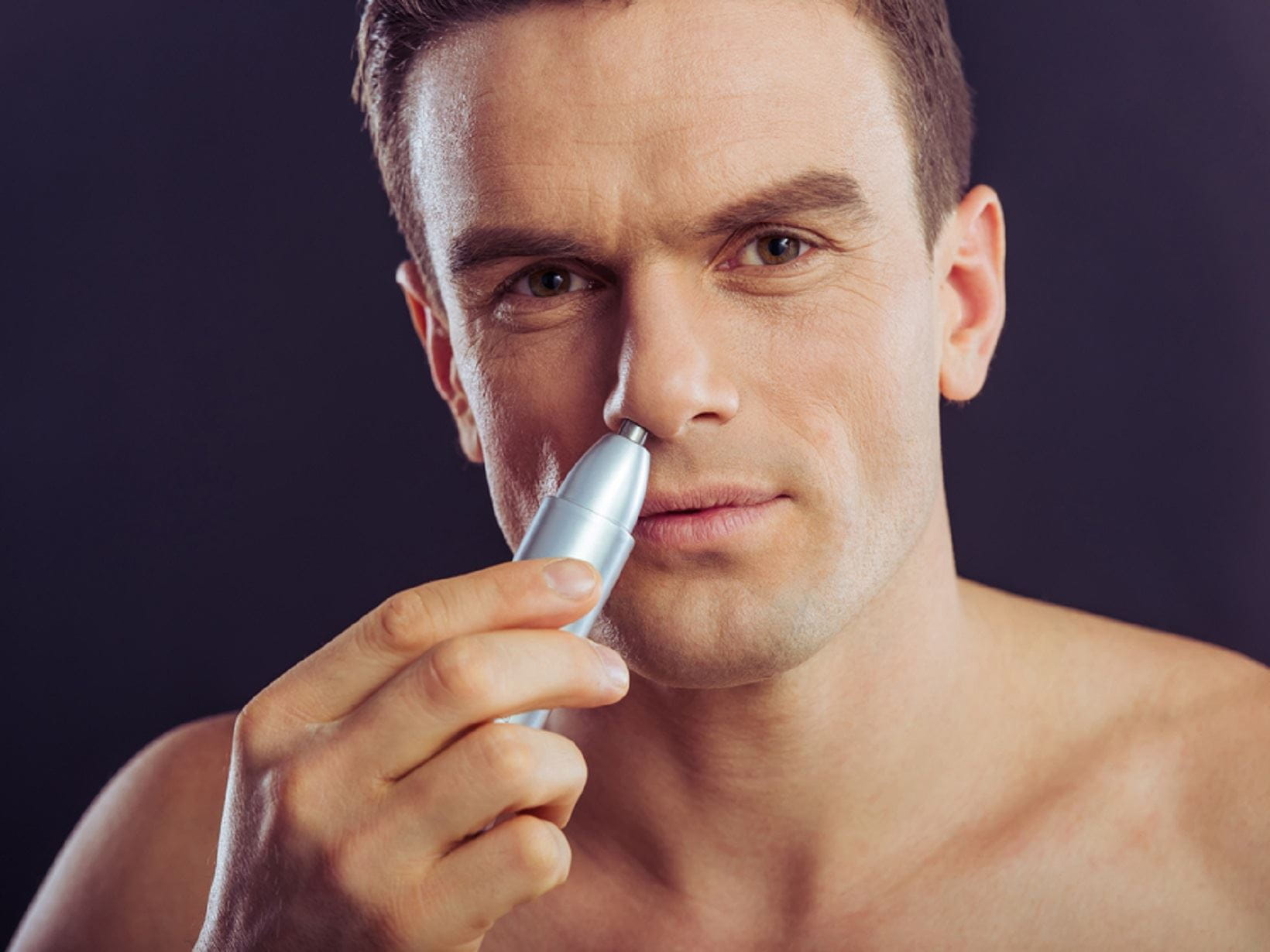 manscaping using a nose hair trimmer