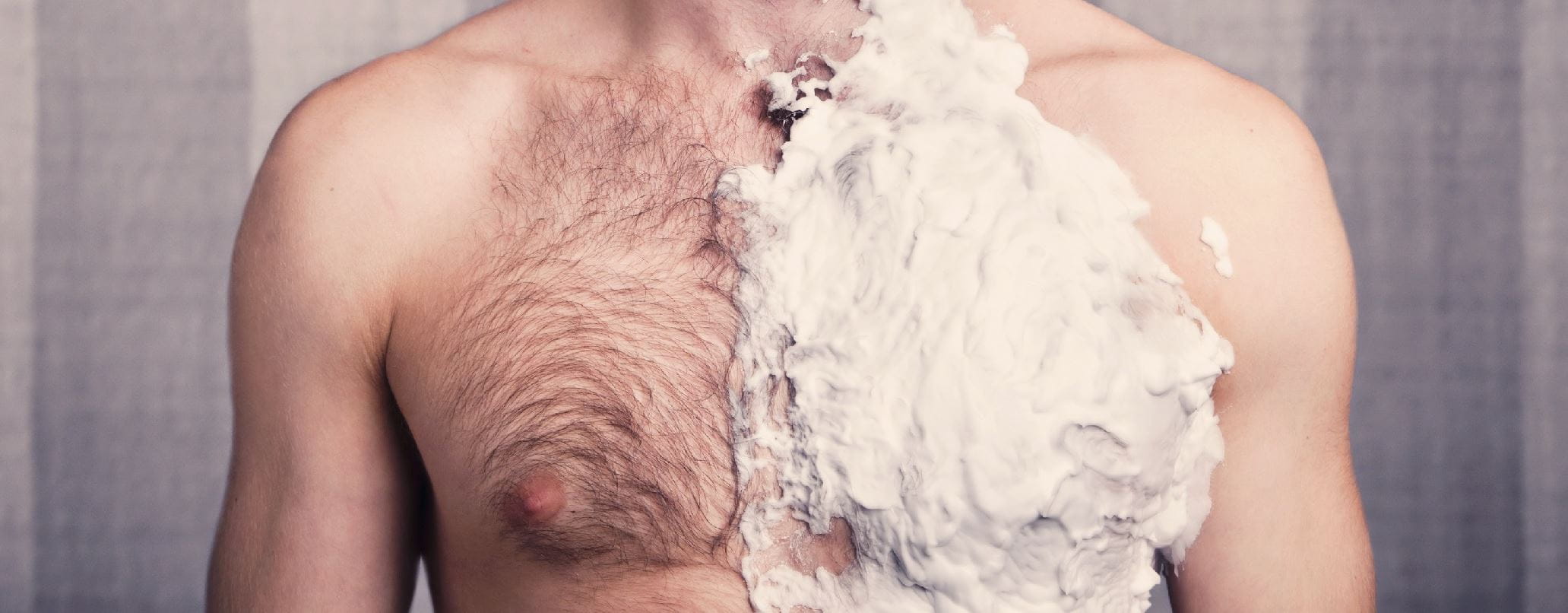 hairy chest of a man with shaving cream