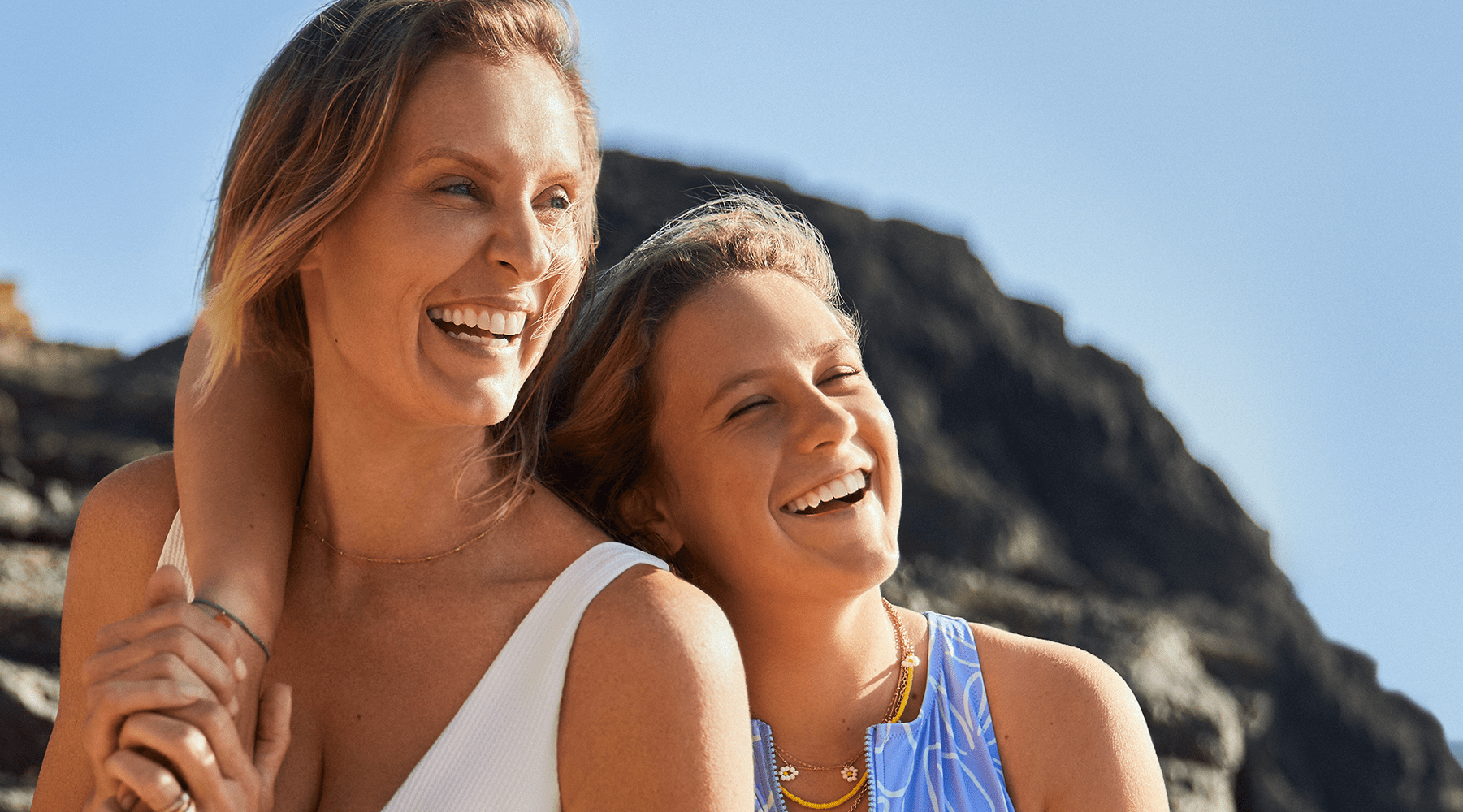 The image represents two women, happy to be ready for the summer sun with Nivea sun protection creams