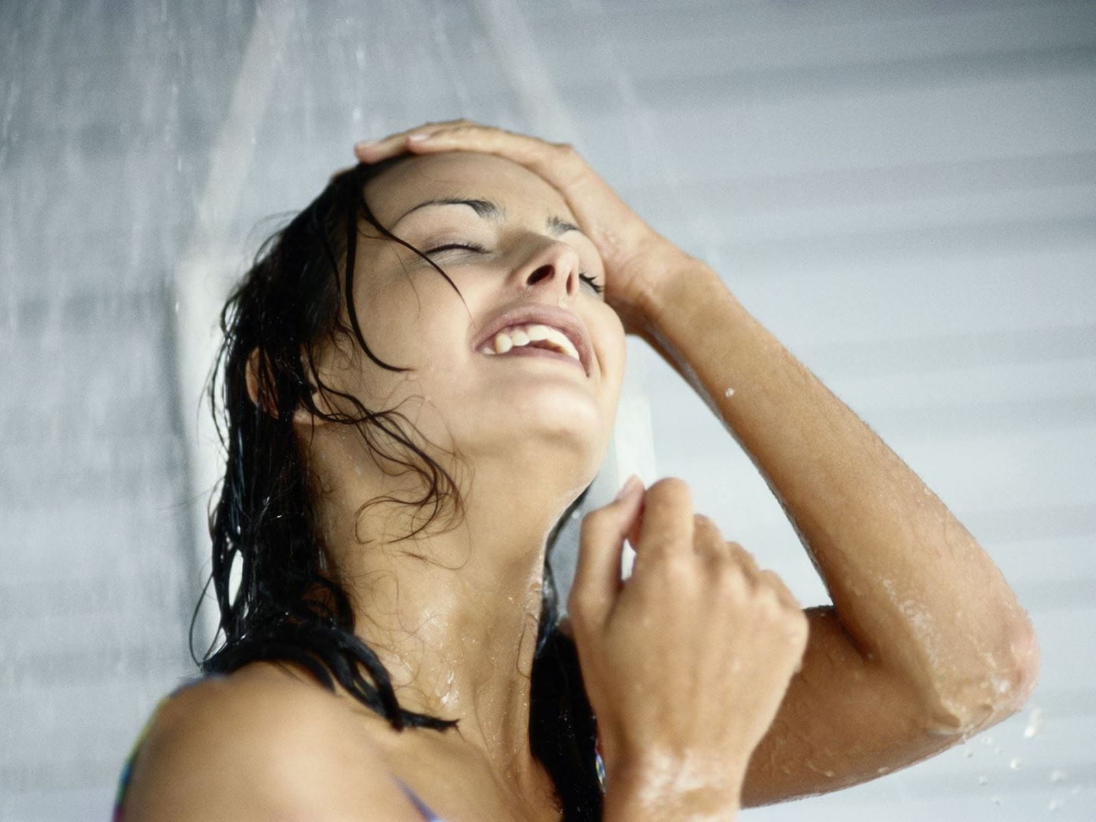 woman using vegan skincare shower gel