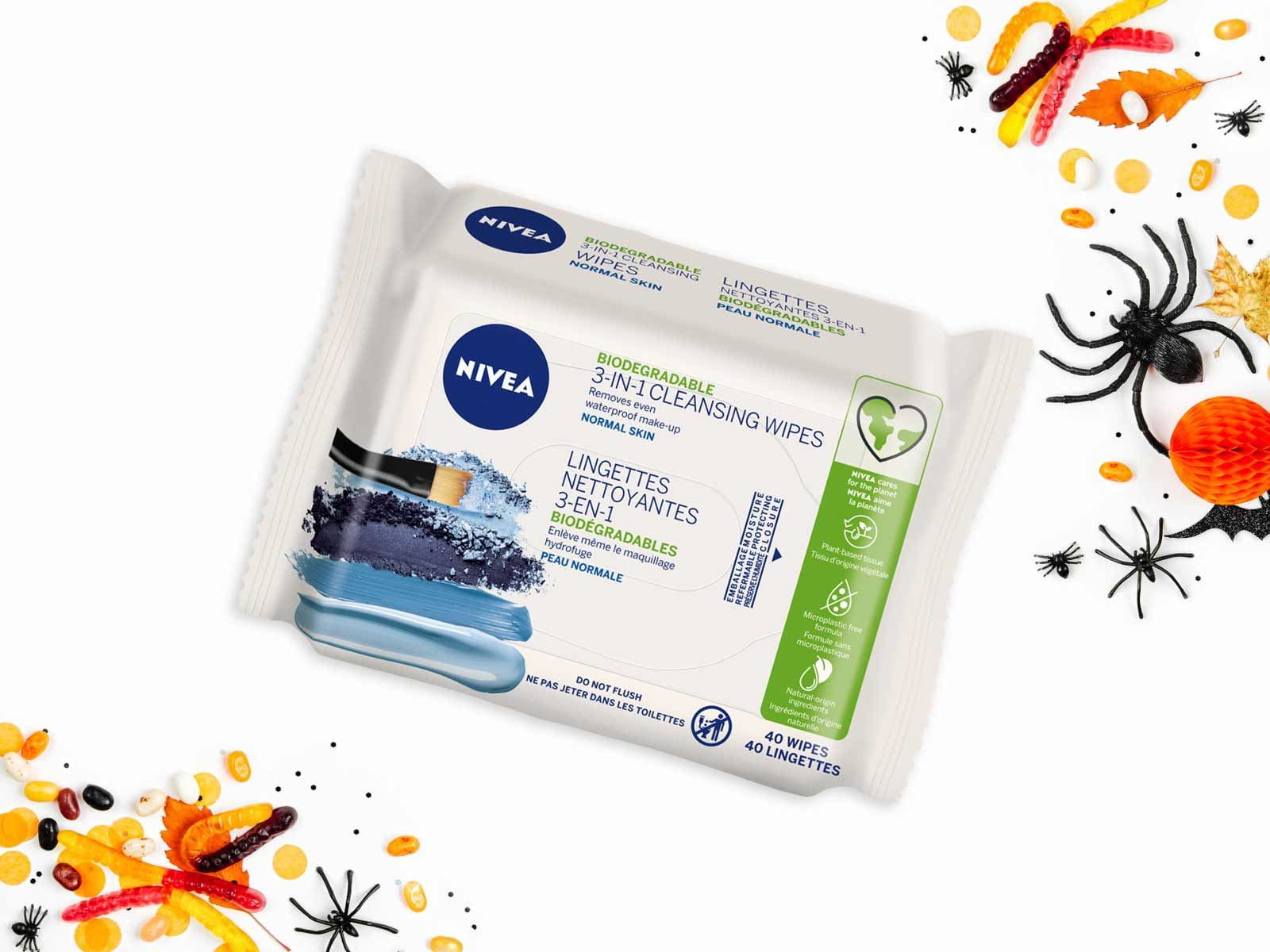 View of Nivea 3 in 1 biodegradable cleansing wipes for normal skin product package against a white background with Fall décor.