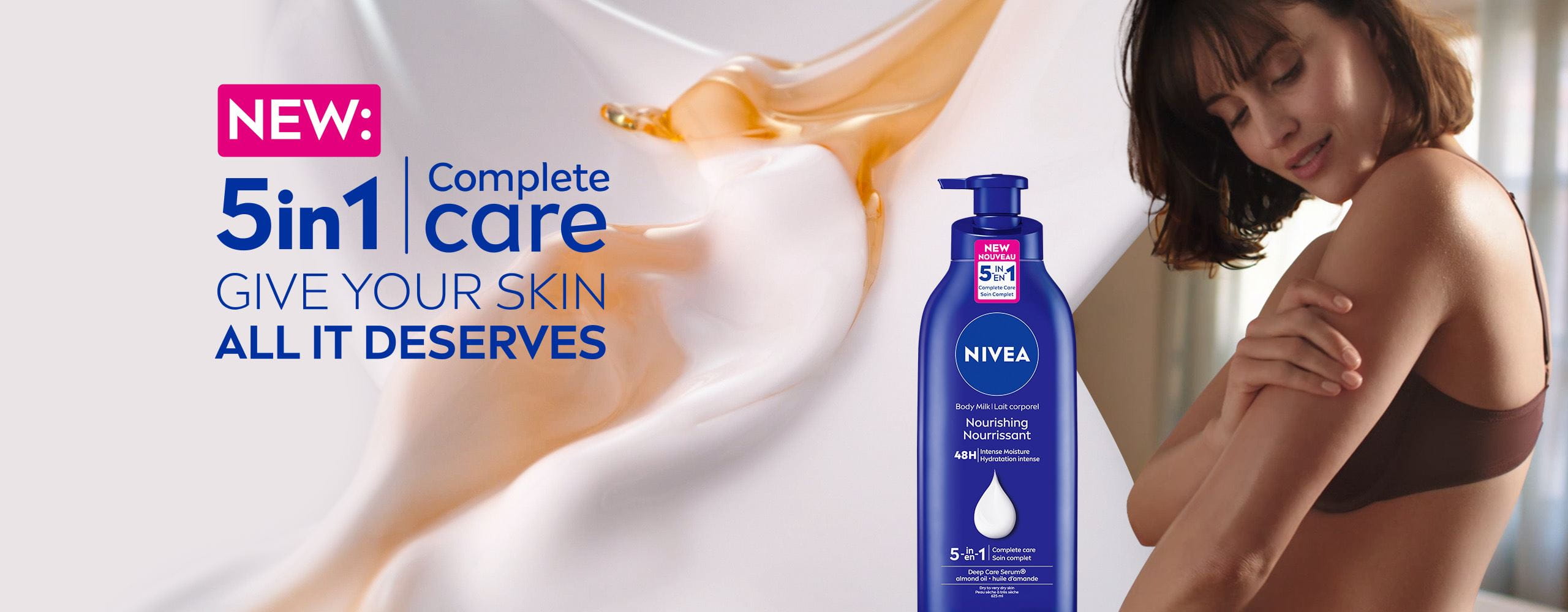 View of a female model holding her left arm with a NIVEA 5in1 Complete Care Nourishing Body Milk product and product text displayed to the left. 