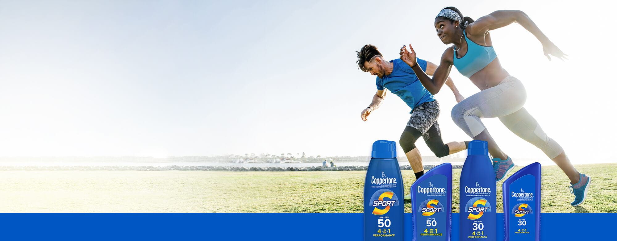 A view of a male and female model running outside in a grass-covered field with four Coppertone Sport Sunscreen products displayed over top.