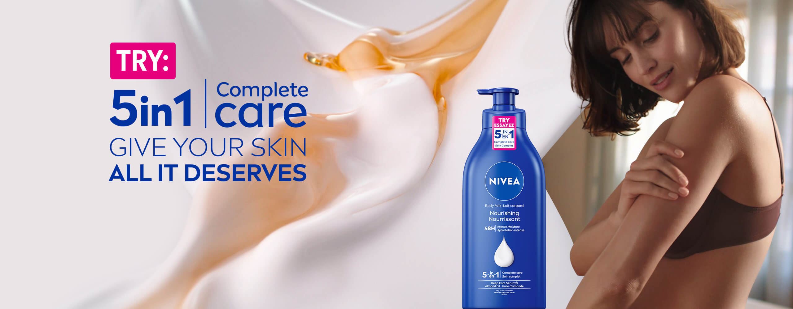 View of a female model holding her left arm with a NIVEA 5-in-1 Complete Care Nourishing Body Milk product and product text displayed to the left.