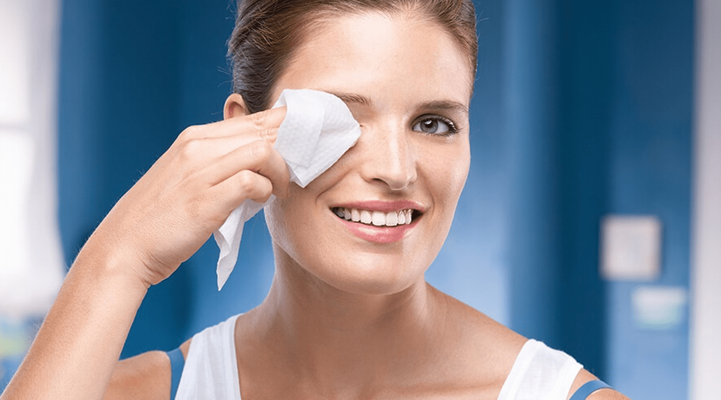 lady wiping her face clean with face wipes