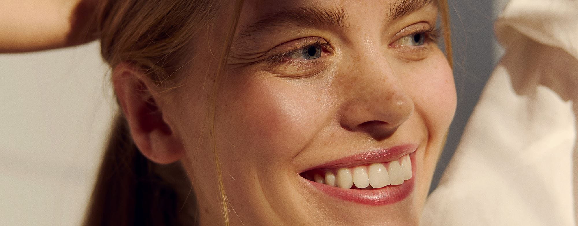 young woman using Nivea Hydra Skin Effect face cream