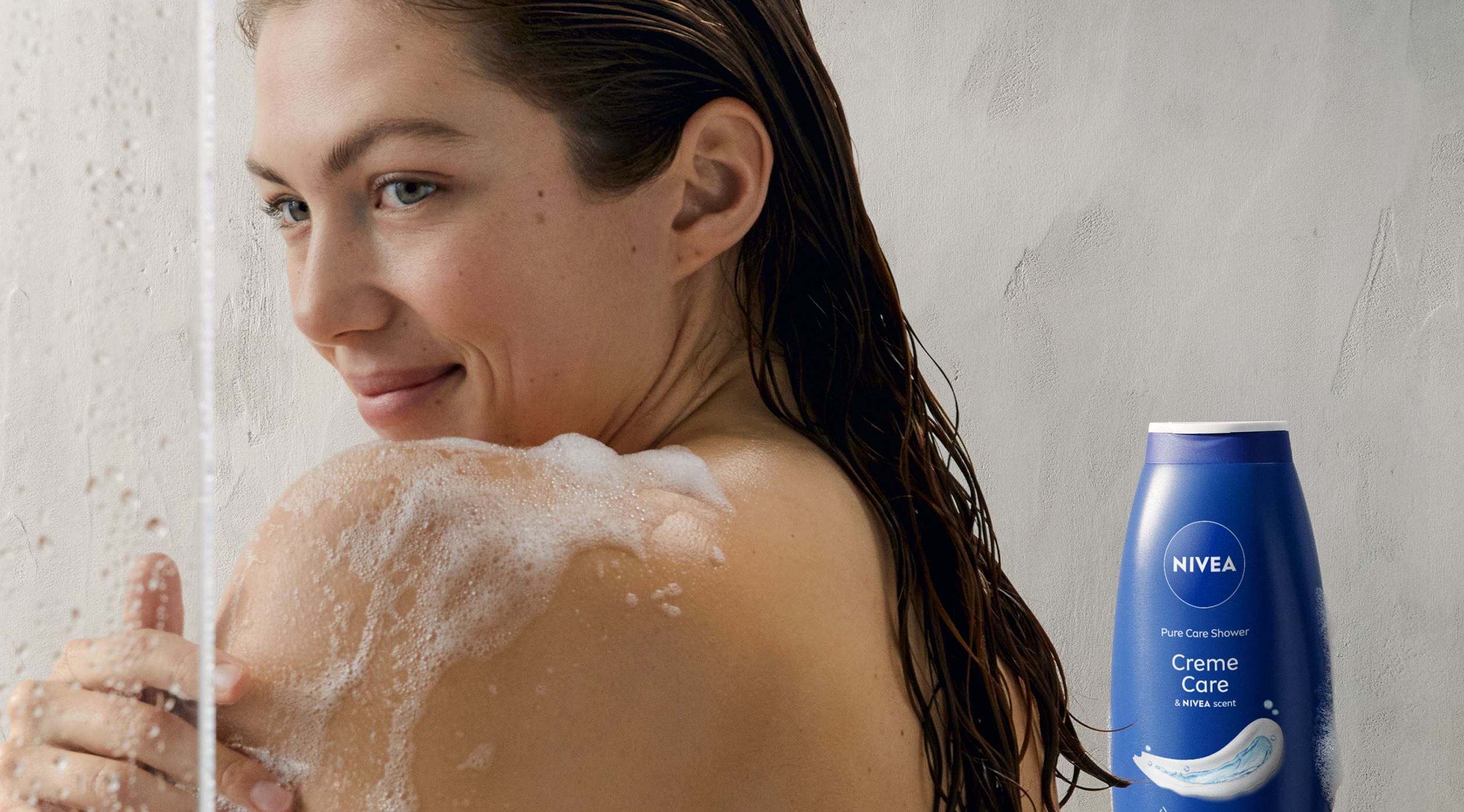 young woman using Nivea shower gel