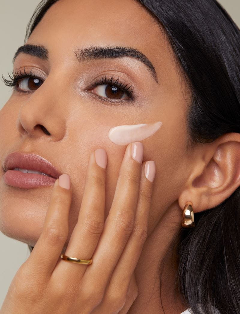 woman applying face cream