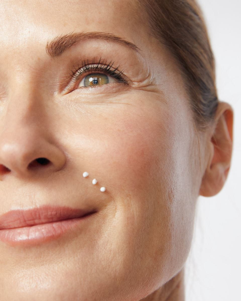 woman applying Nivea anti wrinkles cream