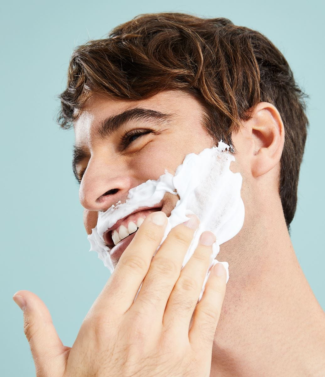 young man applying Nivea shaving cream