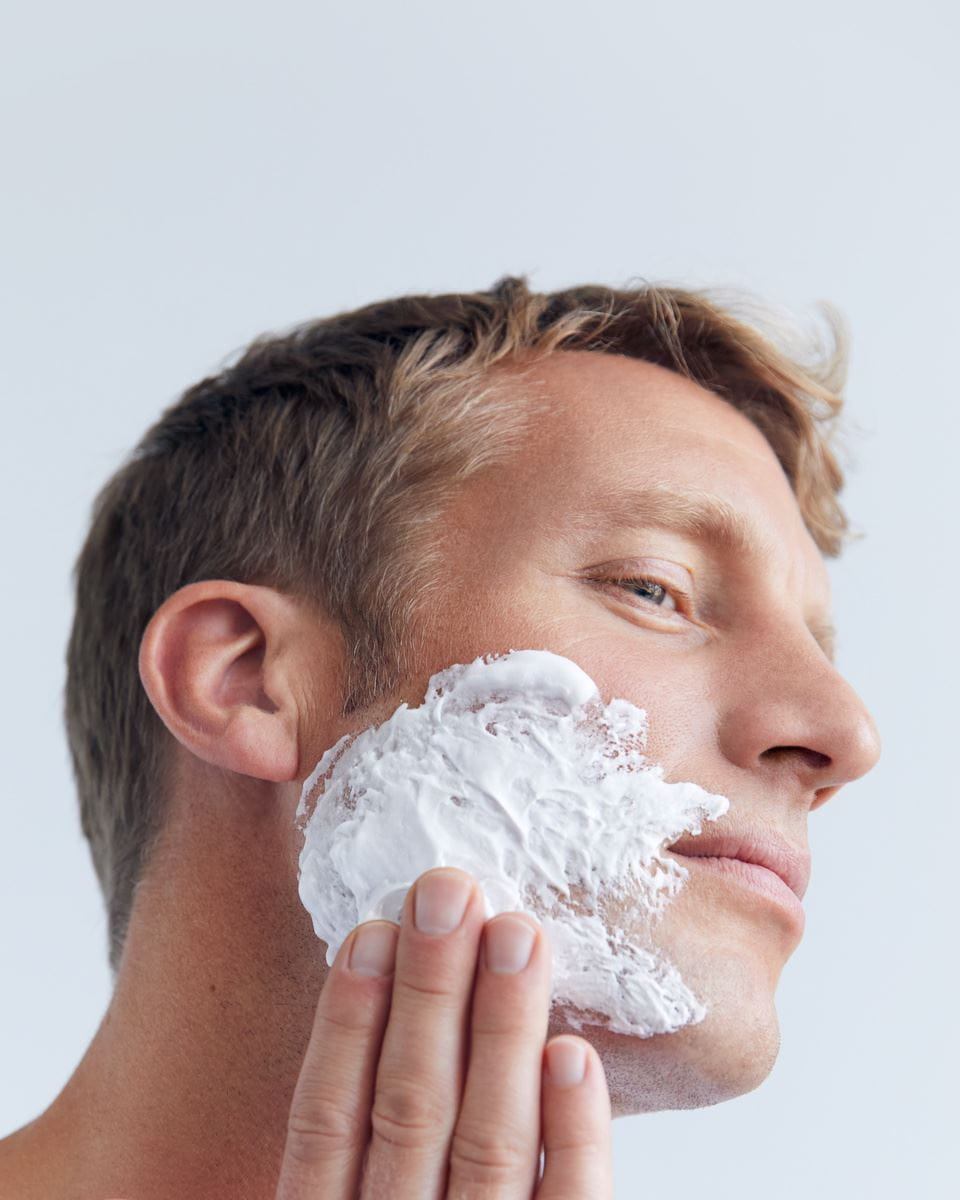 man using shaving gel