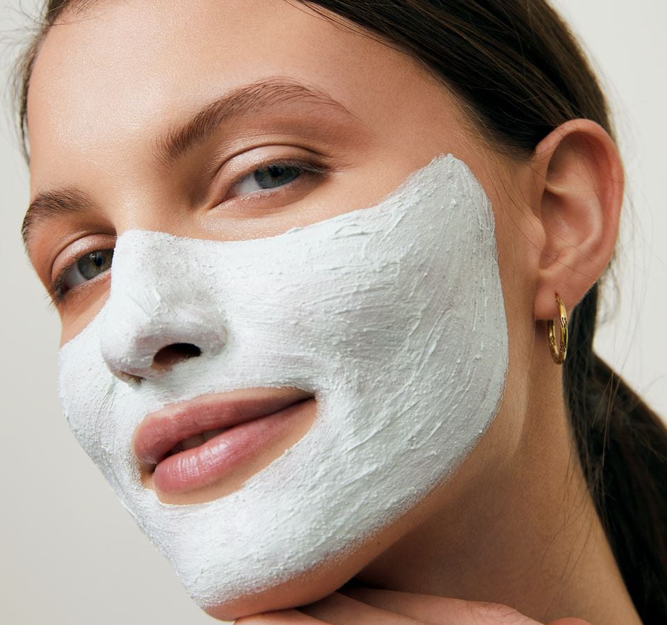 woman with a clay mask on