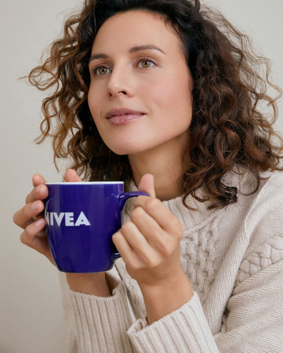 woman with a mug of tea