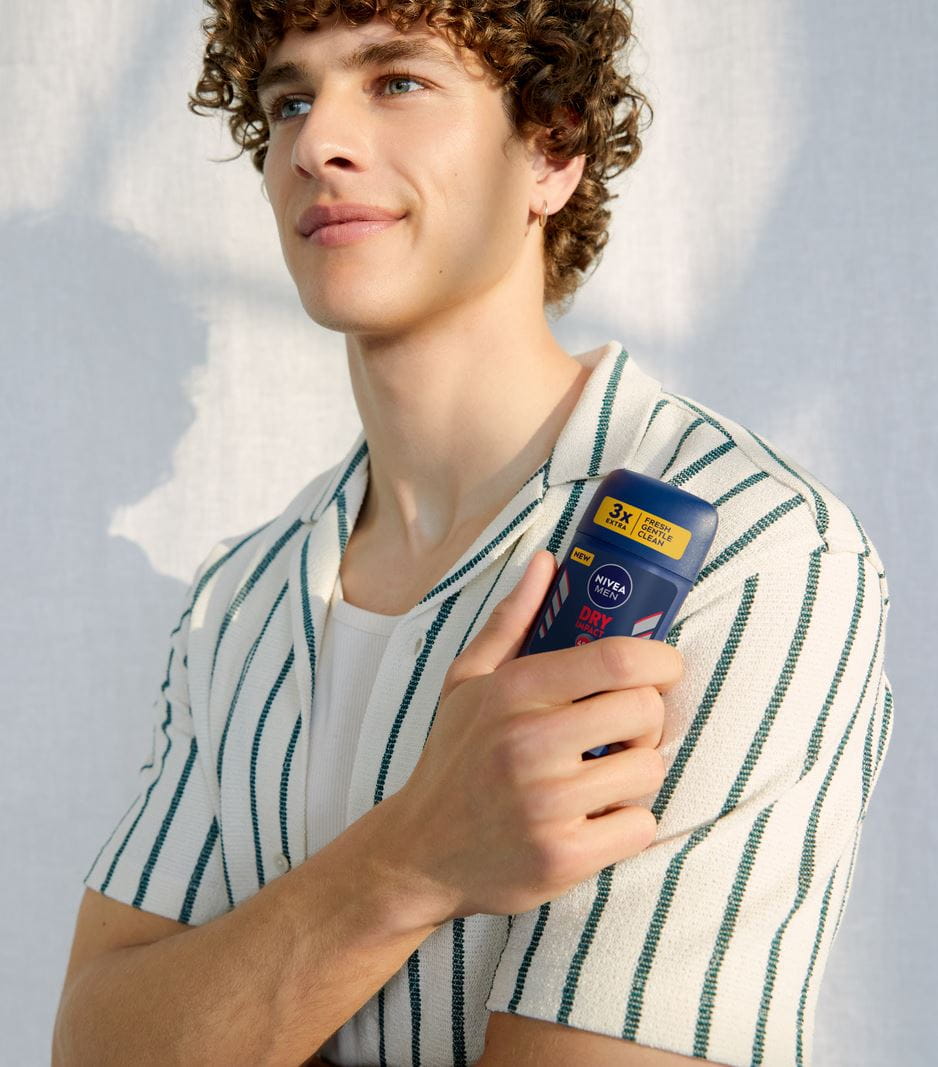 man holding a Nivea antiperspirant