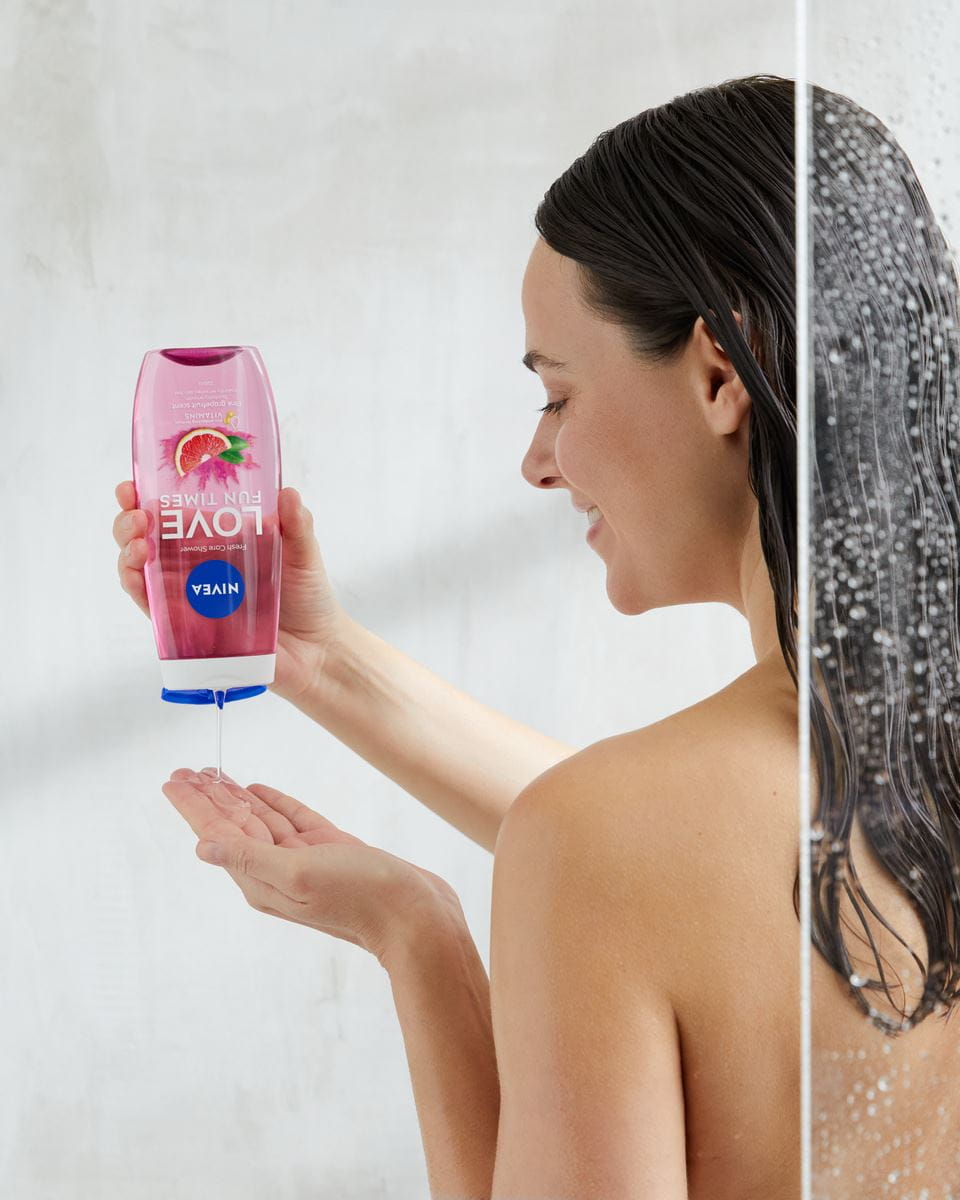 young woman using Nivea Love shower gel