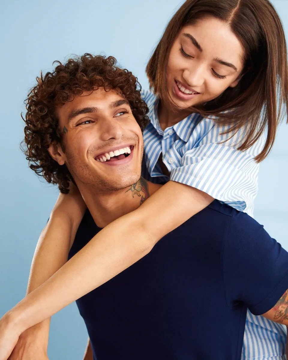 man applying Nivea balm on his face