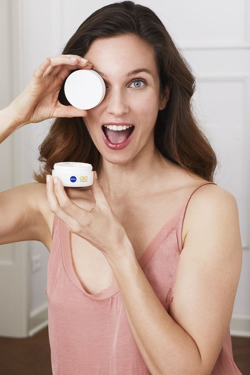 woman using Nivea cream