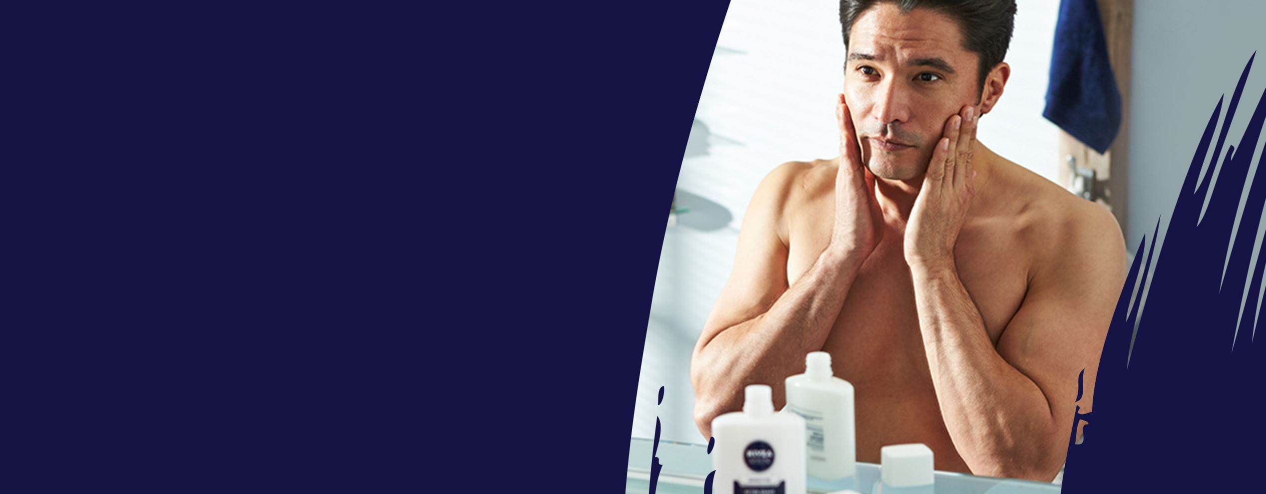 Man applying mens moisturiser in front of a mirror