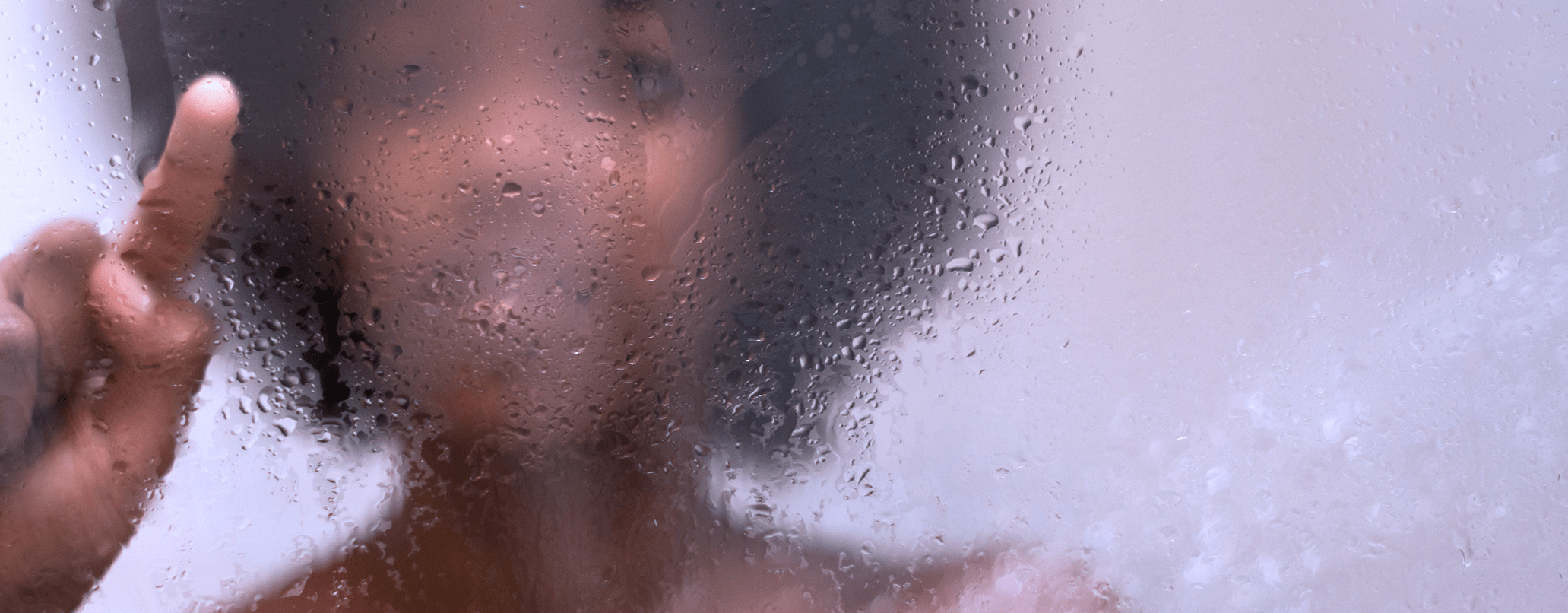 woman-behind-glass-shower-door-header