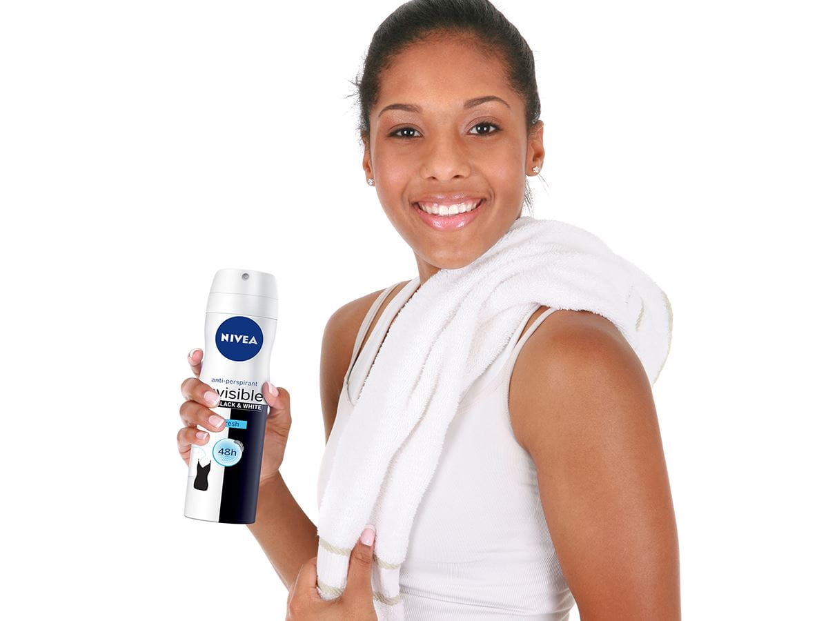 young-woman-applying-deodorant