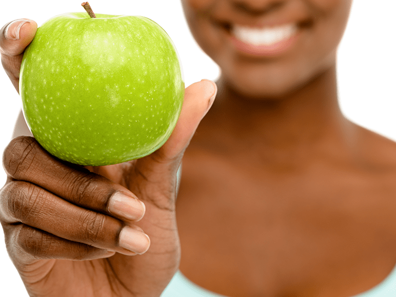 woman-holding-a-green-apple-in-her-hands