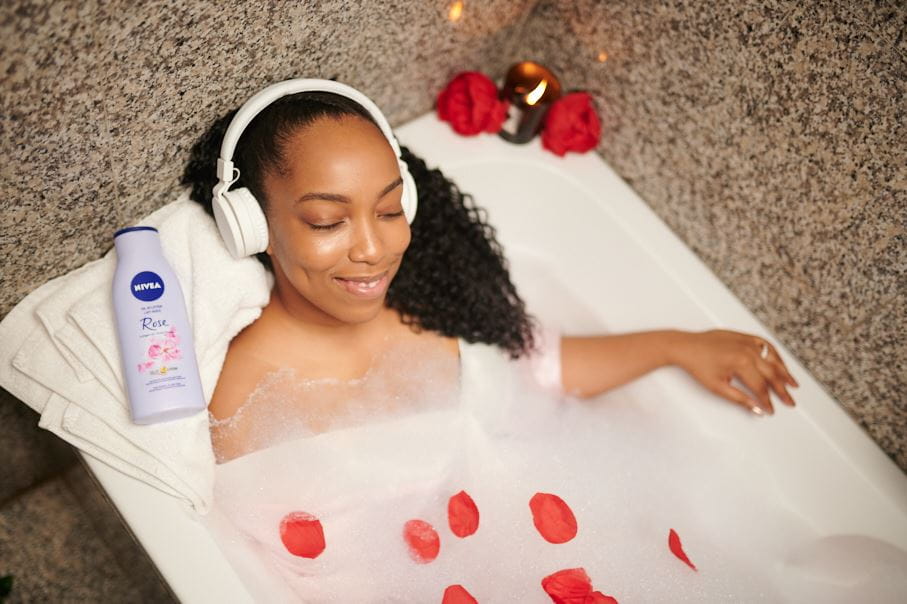 Lady in bath tub with NIVEA Oil in Lotion